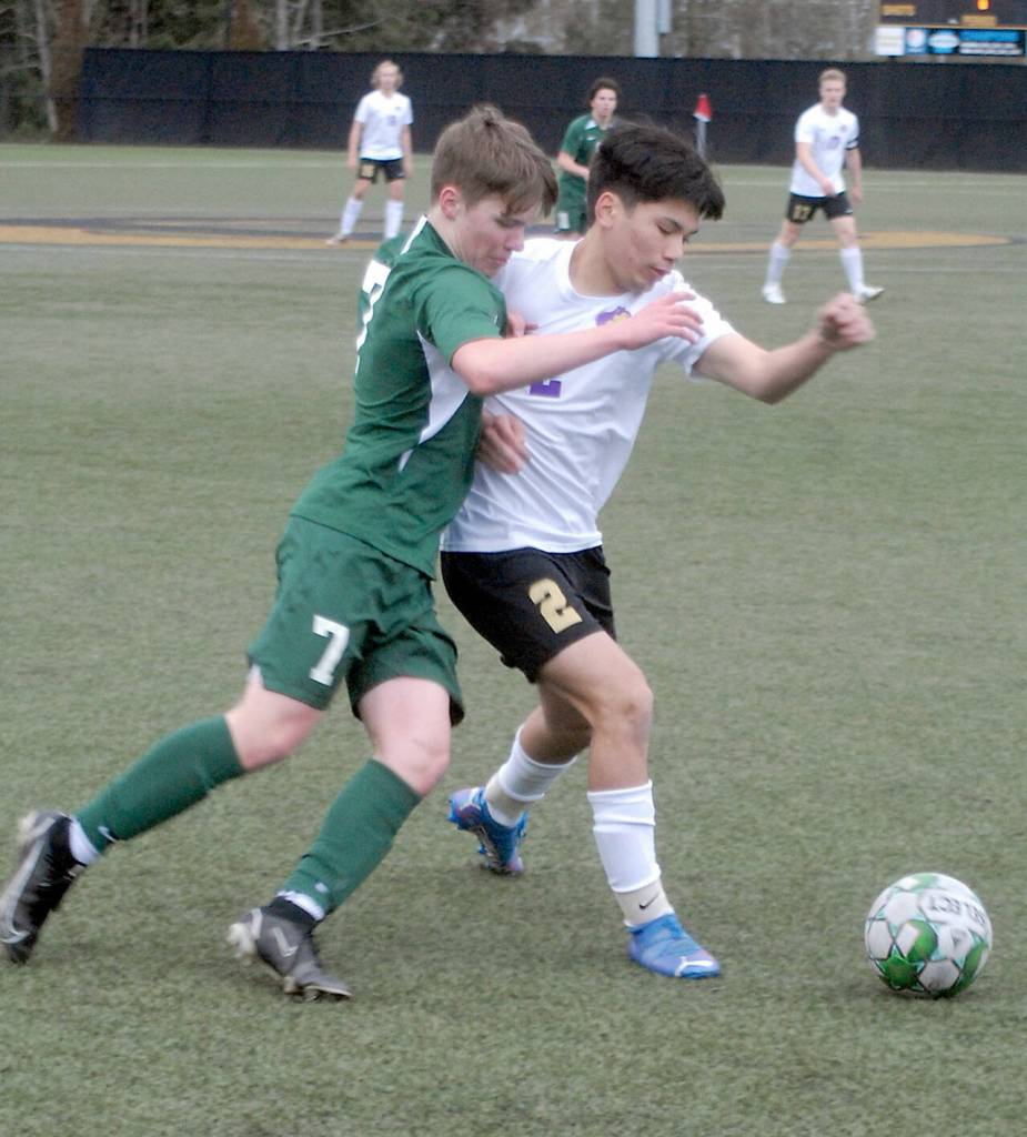 Port Angeles Kaleb Gagnon, left, takes on Sequims Kristian Mingoy on Tuesday in Port Angeles. (Keith Thorpe/Peninsula Daily News)