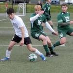 Sequims Kristian Mingoy, left, advances toward the goal as Port Angeles Zak Alton, center, and Dominick Fischer, right, defend during Tuesdays match in Port Angeles. (Keith Thorpe/Peninsula Daily News)