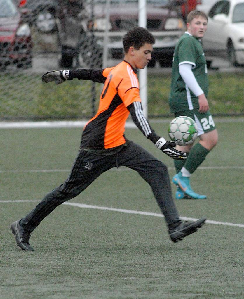 Port Angeles goalkeeper Marcus Hogan prepares to kick downfield as teammate Eli Fischer looks on in Tuesdays game against Sequim at Peninsula College in Port Angeles. (Keith Thorpe/Peninsula Daily News)