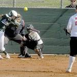 Port Angeles Zoe Smithson bats for a home run to lead off the first inning as Kingston catcher Audrey Rienstra watches the delivery from pitcher Kiera Alvarez on Thursday at the Dry Creek Athletic Fields in Port Angeles. Keith Thorpe/Peninsula Daily News