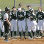 Port Angeles Lily Halberg, right center, is greeted by her teammates as she crosses home plate after a solo home run, the second of the first inning while Kingston catcher Audrey Rienstra looks on during Thursdays game in Port Angeles. Keith Thorpe/Peninsula Daily News