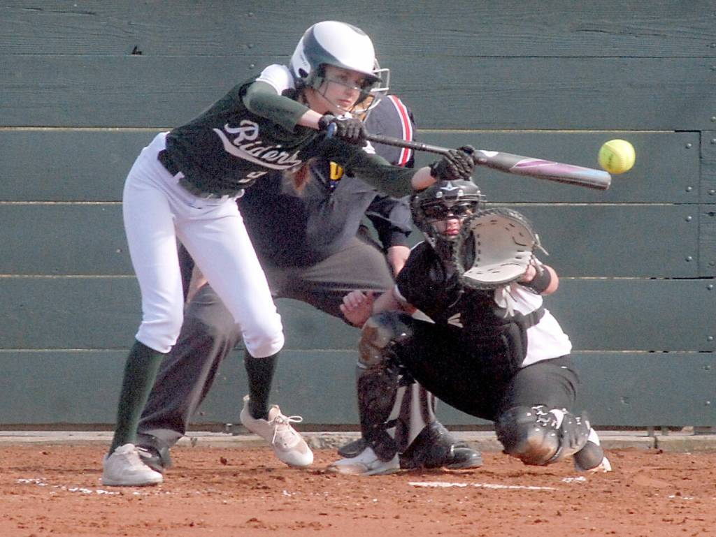 Port Angeles Emi Halberg bunts in the first inning against Kingston on Thursday at Dry Creek School in Port Angeles. Keith Thorpe/Peninsula Daily News
