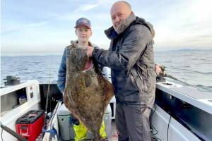 Port Ludlow's Johnson family found success on the opening day of halibut season last week. Caleb Johnson, age 12, caught this 43-pound specimen held by his dad Jeremiah. The family planned to target lingcod on their next family fishing outing.
