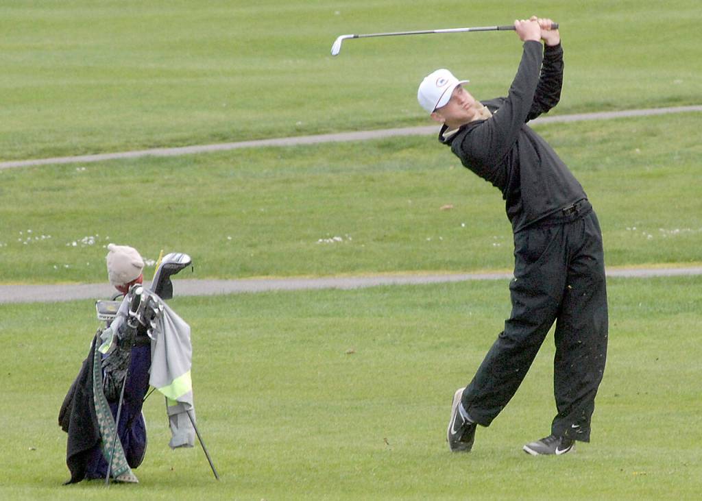 Dominic Riccobene of Sequim drives toward the green on the first hole on Friday in Port Angeles. (Keith Thorpe/Peninsula Daily News)