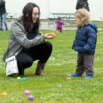 Elizabeth Bales of Port Angeles offers an Easter egg to her son, Remy, 1, at the 44th annual KONP Easter Egg Hunt at the Clallam County Fairgrounds in Port Angeles. Hundreds of children and their parents took part in the event, which also featured a visit from the Easter Bunny and a drawing for prizes. (Keith Thorpe/Peninsula Daily News)
