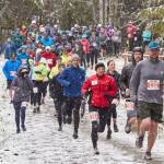 Runners start the 12K portion of the annual Olympic Adventure Trail run along Kelly Ridge west of Port Angeles this weekend. Heavy snow, sleep, hail and rain greeted runners during this years race. (Matt Sagen/Cascadia Films)