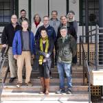 The new Creative Alliance at Fort Worden State Park includes, clockwise from left, Copper Canyon Press Joseph Bednarik; Heron Scott of the Port Townsend School of Woodworking; Renee Klein of Madrona MindBody Institute; Centrums Rob Birman; KPTZs Robert Ambrose, Copper Canyons George Knotek; KPTZs Kate Ingram; Corvidae Press Randy Arnest; Northwind Arts Teresa Verraes and Fort Worden Public Development Authority Executive Director David Timmons. (Brian Goodman)
