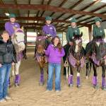 The high school equestrian teams from Port Angeles and Sequim merged to compete in Freestyle 4 Drill Team, placing first in Meet 3. Winning the gold medal were Joanna Seelye, left, Libby Swanberg, Maggie Anderson and Sydney Hutton with coaches Katie Newton, left, and Keri Tucker. Watch them compete live at state finals May 19-22 by visiting https://www.wahset.info/stream-links and clicking on District 4. (Courtesy photo)