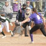 Michael Dashiell/Olympic Peninsula News Group
Port Angeles' Zoe Smith hits the ball past Sequim pitcher Angel Wagner as Wolves' catcher Christy Grubb is also in on the play.