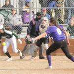 Port Angeles Zoe Smith hits the ball past Sequim pitcher Angel Wagner as Wolves catcher Christy Grubb is also in on the play. (Michael Dashiell/Olympic Peninsula News Group)