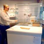 Rachel Storck, community engagement manager for the Port Angeles Fine Arts Center, points out a display case where exhibit pieces were taken during a weekend burglary. (Keith Thorpe/Peninsula Daily News)