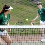 Keith Thorpe/Peninsula Daily News
Port Angeles double team members Angelina Sprague, left, and Kinnley Brady compete against the Bainbridge Island team of Emily Knighton and Kristina Walker on Friday at Port Angeles High School.
