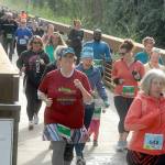 Runners take off from the start of the Railroad Bridge race of the Run the Peninsula Road Race Series on Saturday at Railroad Bridge Park in Sequim. The event, which consisted of a 5K and 10K run on the Olympic Discovery Trail, was second of the series, which also includes upcoming races on the Larry Scott Trail in Port Townsend, the Jamestown SKlallam Reservation in Blyn and the North Olympic Discovery Marathon. (Keith Thorpe/Peninsula Daily News)