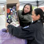 Nicole Salim, evidence manager for the Clallam County Sheriffs Office, left, and Detective Swift Sanchez of the Port Angeles Police Department dump medicines into a collection box during National Prescription Drug Take Back Day on Saturday at a drop-off site at the Clallam County Courthouse in Port Angeles. At the event, people were allowed to anonymously bring in expired, unused and unwanted prescription drugs for safe disposal. Similar drop-off sites on the North Olympic Peninsula were set for Sequim, Quilcene and Port Hadlock. (Keith Thorpe/Peninsula Daily News)