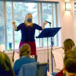 Guest conductor Jolene Dalton Gailey of Port Angeles leads the RainShadow Chorale in rehearsal for two concerts in Chimacum this week. (Diane Urbani de la Paz/Peninsula Daily News)