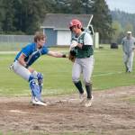 East Jefferson catcher Cash Holmes tags out Charles Wrights Nico Rose as he tries to score a run in the second game of a Wednesday doubleheader played in Chimacum. (Steve Mullensky/for Peninsula Daily News)