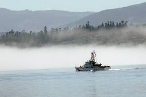 Keith Thorpe/Peninsula Daily News
The U.S, Coast Guard cutter Cuttyhunk sails across Port Angeles Harbor against a backdrop of fog hugging the shoreline. in June 2020.