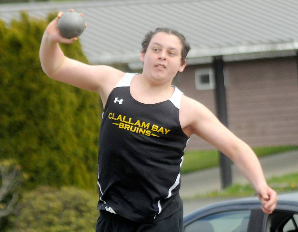 Clallam Bays Daniel Cumming tosses the shot during Fridays North Olympic League meet at Crescent School. (Keith Thorpe/Peninsula Daily News)