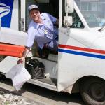 Alex Baker of the USPS picks up some food donations on his west Port Angeles route several years ago.