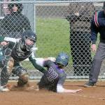 Keith Thorpe/Peninsula Daily News
Port Angeles catcher Zoe Smithson, left, tags out North Kitsap's Alison Dovorak at home plate on Thursday in Port Angeles.