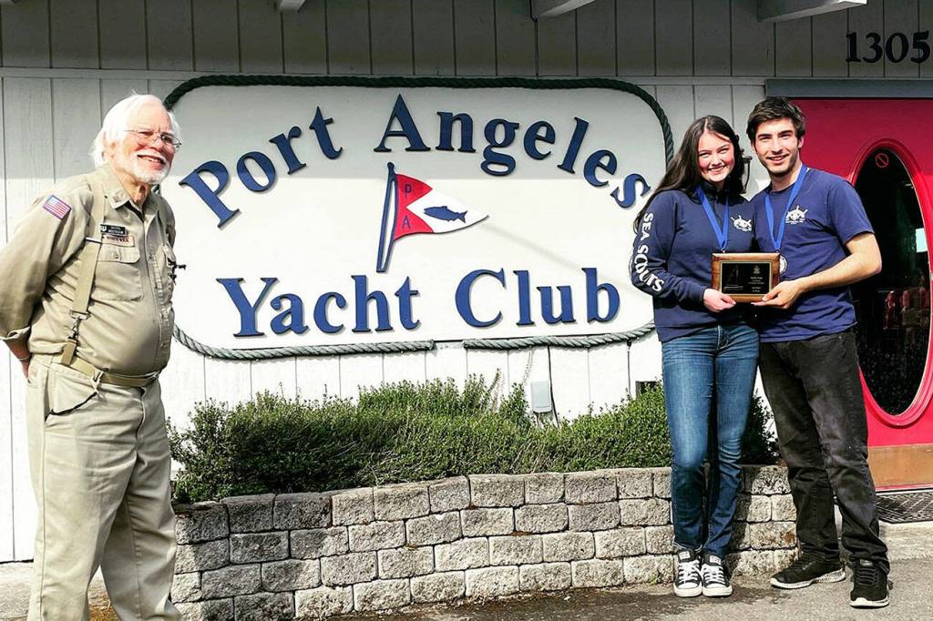 Sailors Ella Schultz, middle, and Ozzy Minard earned a first-place finish in the first Kelly Cup Regatta hosted by the Sea Scout Ship Marvin Shields and the Port Angeles Yacht Club (represented by Doug Mecham).
