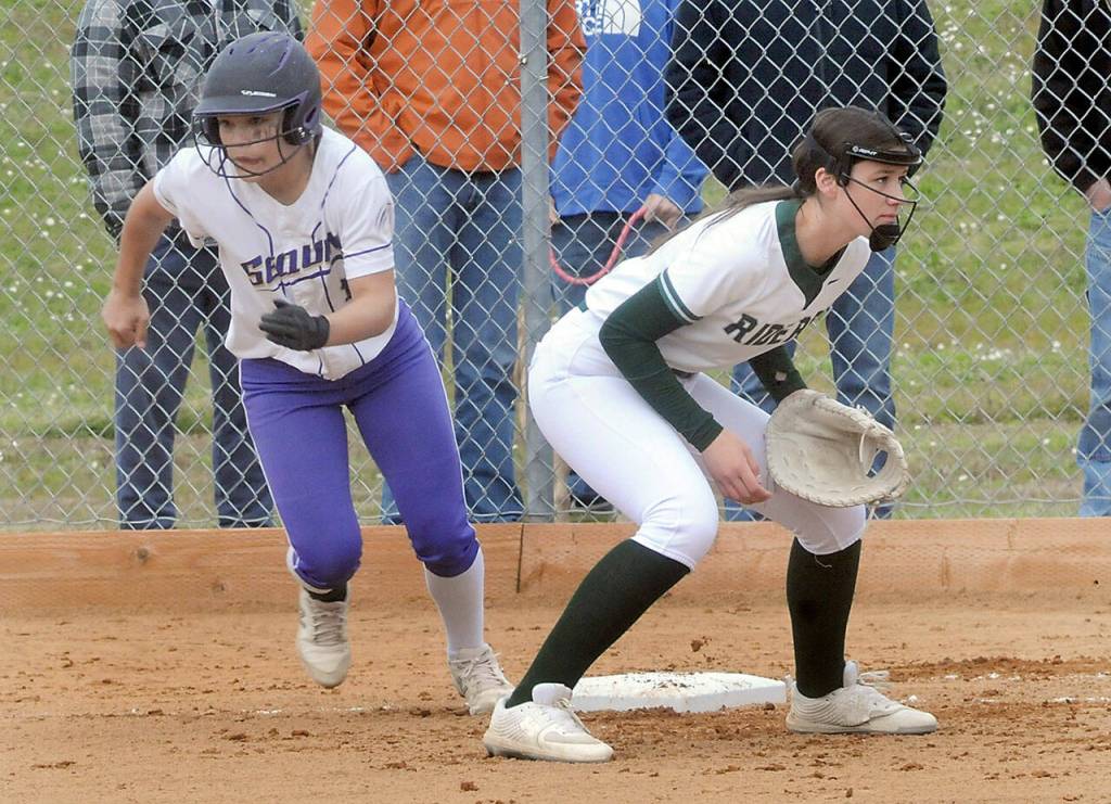 Sequims Tayli Rome takes off for second as Port Angeles first baseman Lexie Smith watches the delivery on Friday in Port Angeles. (Keith Thorpe/Peninsula Daily News)