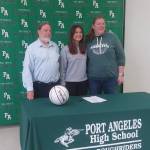 From left, Port Angeles head girls basketball coach Michael Poindexter, Eve Burke and assistant coach Jennifer Rogers at Burkes signing to play for Linfield College in McMinnville, Ore. (Pierre LaBossiere/Peninsula Daily News)