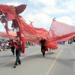 A stylized dragon with its mouth operated by Kurt White makes its way down Washington Street as part of the Olympic Theatre Arts entry in Saturdays Sequim Irrigation Festival Grand Parade. The event returned to an in-person activity with more than 90 entries and thousands of spectators lining the parade route. (Keith Thorpe/Peninsula Daily News)