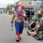 Ed Matuska, a clown with the Olympic Peninsula Shrine, delights children lining Washington Street as part of the Nile Shrine entry in Saturdays grand parade. (Keith Thorpe/Peninsula Daily News)