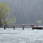 Keith Thorpe/Peninsula Daily News
Visitors to Lake Crescent Lodge at Barnes Point contemplate swimming from the lodge's dock on Tuesday in Olympic National Park southwest of Port Angeles. Lake Crescent is one of the parks most visited attractions, drawing thousands of visitors each year to marvel at the interface of mountains and water.