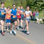After a two-year hiatus, the Rhody Run took off again on Sunday in a new venue, the Jefferson County Fairgrounds. At the starting gun, the trio of Owen Chamberlain, from Tacoma, John Munro, from Port Townsend and the city manager, and Seamus Fraser, from Port Townsend, lead the pack around the 6.2-mile (10K) course. Fraser won the event with an official time of 35 minutes, 12.33 seconds. Munro was first in his age group of 45-49 and third overall with a time of 36:56.72. (Steve Mullensky/for Peninsula Daily News)