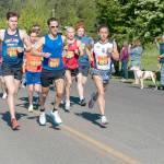 After a two-year hiatus, the Rhody Run took off again on Sunday in a new venue, the Jefferson County Fairgrounds. At the starting gun, the trio of Owen Chamberlain, from Tacoma, John Munro, from Port Townsend and the city manager, and Seamus Fraser, from Port Townsend, lead the pack around the 6.2-mile (10K) course. Fraser won the event with an official time of 35 minutes, 12.33 seconds. Munro was first in his age group of 45-49 and third overall with a time of 36:56.72. (Steve Mullensky/for Peninsula Daily News)