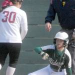 Keith Thorpe/Peninsula Daily News
Port Angeles baserunner Peyton Rudd looks towards Kingston pitcher Jayla Moon while stealing home after a wild pitch got away from the catcher during a game earlier this season.