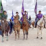 High school equestrians Maggie Anderson, left, Sydney Hutton, Libby Swanberg and Joanna Seelye prepare to enter the arena for the Grand Entry at Washington High School Equestrian Team (WAHSET) State Finals. (Courtesy photo)