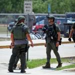 Law enforcement personnel stand outside Robb Elementary School following a shooting Tuesday in Uvalde, Texas. (AP Photo/Dario Lopez-Mills)