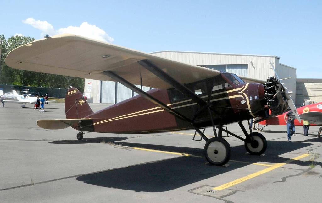 A Stinson SM-8A Detroiter belonging to Port Townsend Aero Museum sits on display at Armed Forces & Public Safety Airport Appreciation Day and Fly-in on Saturday at William R. Fairchild International Airport in Port Angeles. (Keith Thorpe/Peninsula Daily News)