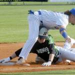 Keith Thorpe/Peninsula Daily News
Lefties second baseman Gabrial De Jesus, top, stuggles to keep his balance after tagging out Northwest's Jesse Bechtold on a steal attemp in the first inning on Friday evening at Port Angeles Civic Field.