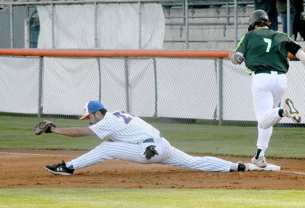 Lefties first baseman Hunter Kirkpatrick stretches long to make the catch, beating Northwests Noah Christiansen to the bag on Friday at Port Angeles Civic Field. (Keith Thorpe/Peninsula Daily News)