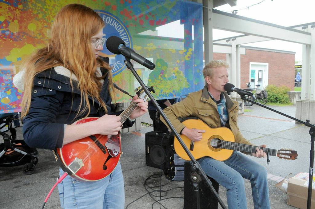 AB McSpadden, left, and Tex Armstrong of True Reckoning from Port Townsend play on the Juan de Fuca Festivals Community Stage in front of Vern Burton Community Center on Saturday. (Keith Thorpe/Peninsula Daily News)