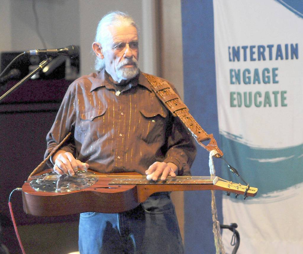 Bob Lawrence-Markarian of the Port Angeles band Twisted Roots plays with the group on Saturday in Port Angeles. (Keith Thorpe/Peninsula Daily News)
