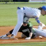 Lefties second baseman Gabriel DeJesus, top, stuggles to keep his balance after tagging out Northwests Jesse Bechtold on a steal attemp in the first inning on Friday evening at Port Angeles Civic Field. (Keith Thorpe/Peninsula Daily News)