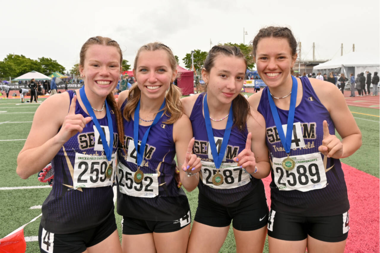 From left, Riley Pyeatt, Hiilei Robinson, Kaitlyn Bloomenrader, Eve Mavy, members of the Sequim girls 4x400 relay team, celebrate their state championship at the 2A meet at Mount Tahoma Stadium on Saturday. (Michael Dashiell/Olympic Peninsula News Group)