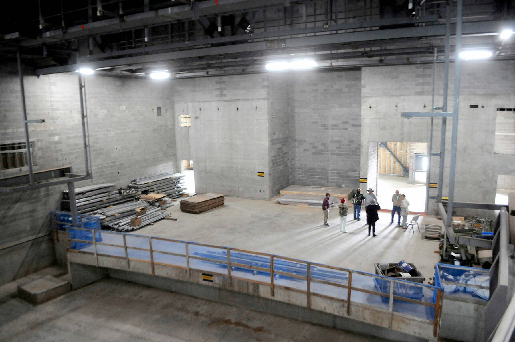 Visitors gather on the stage of the auditorium during Thursdays open house at the Field Arts & Events Hall. (Keith Thorpe/Peninsula Daily News)
