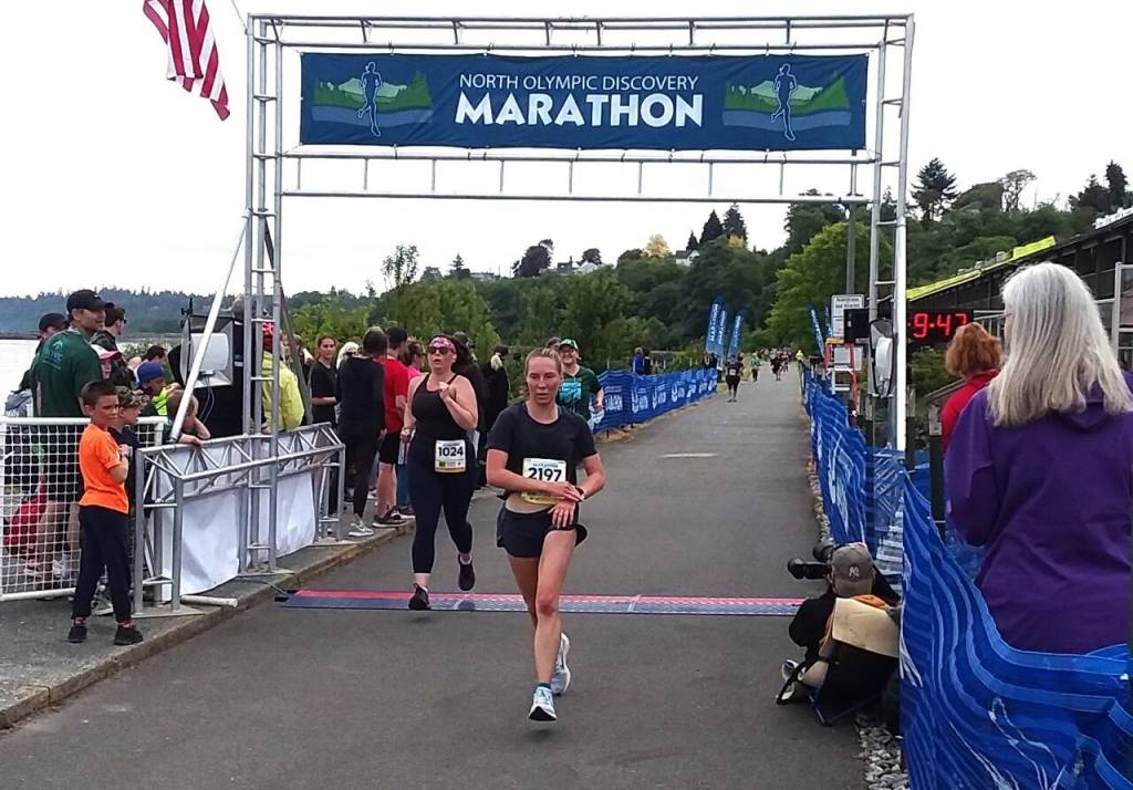 Port Angeles Lauren Larson, now a runner for Boise State, wins the womens 10K at the North Olympic Discovery Marathon on Saturday. (Pierre LaBossiere/Peninsula Daily News)