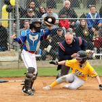 Elks Ben Clemens slides safely into home as the Eagles catcher Felix Gonzales gets the ball from the outfield to make the tag. Clemens scored two runs but the Eagles were able to win the Cal Ripken city championship game 7-2 Tuesday at the Lincoln Park complex. (Dave Logan/For Peninsula Daily News)