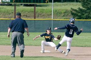Dave Logan/for Peninsula Daily News
Westport’s Rylan Politika slides into second base but is met by Forks’ shortstop Dylan Micheau with the ball already in his glove for the out during the Olympic Junior Babe Ruth Championship at Volunteer Field.