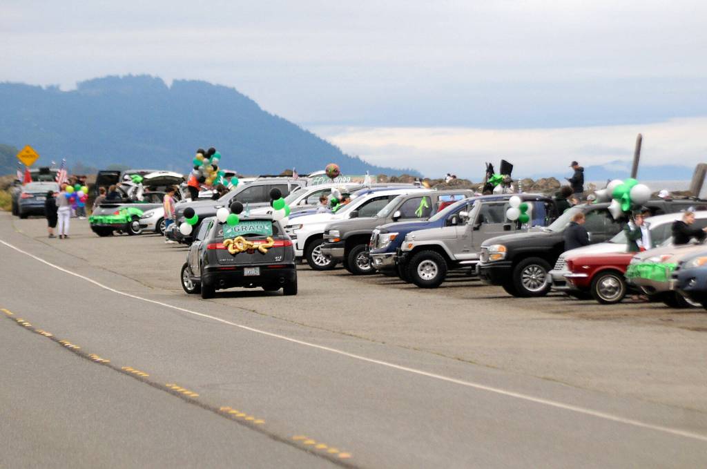 Vehicles participating in Fridays Port Angeles High School graduation parade stage on Ediz Hook before embarking on a route through the city to Port Angeles High School. (Keith Thorpe/Peninsula Daily News)
