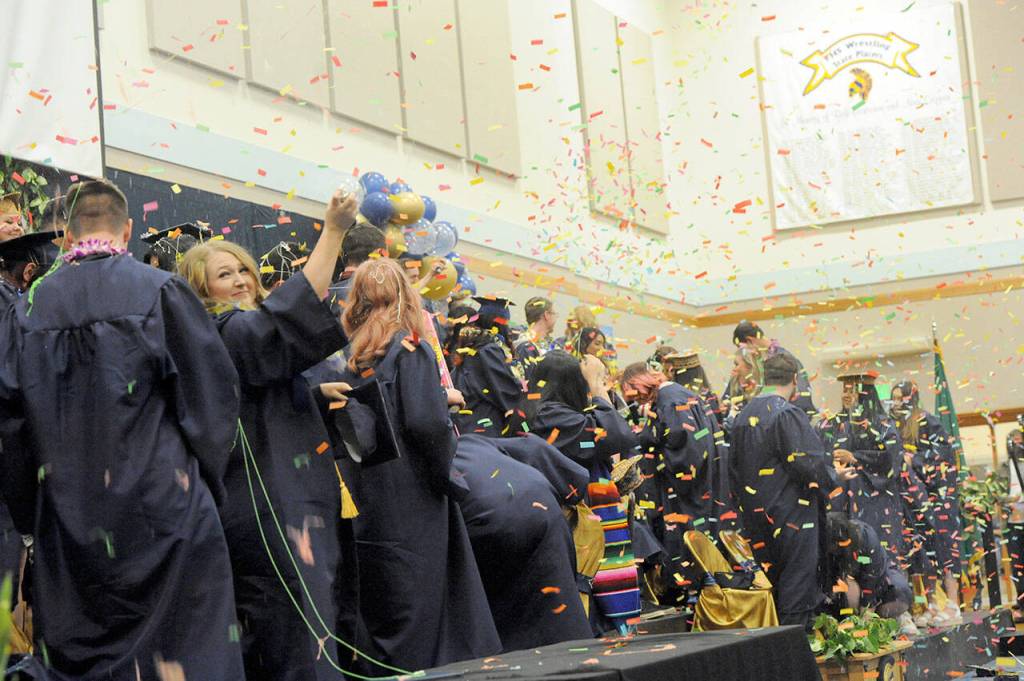 Lots of confetti was on the menu Saturday afternoon at the Spartan Gym, where 59 seniors graduated from Forks High school. (Lonnie Archibald/for Peninsula Daily News)