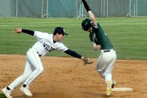 Keith Thorpe/Peninsula Daily News
Wilder second baseman Payton Cagey, left, tags out Lakeside Recovery baserunner Luke Reynolds, who was caught in a rundown between first and second on Saturday at Port Angeles Civic Field.