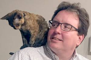 Ryan Malane with one of his cats.